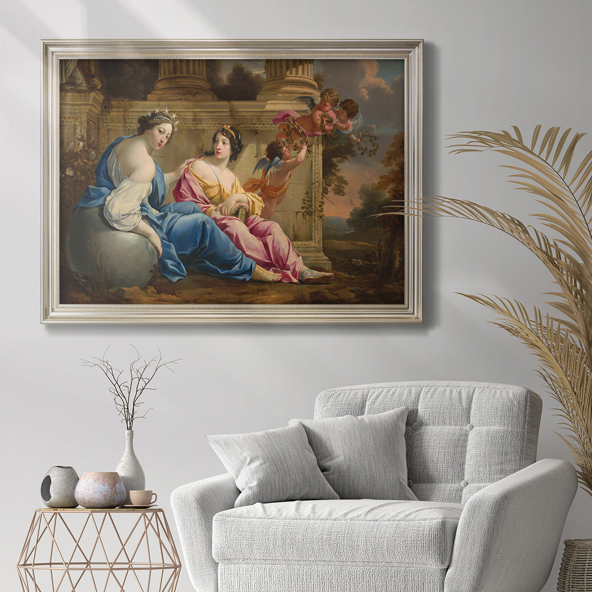Classical allegorical painting of the muses by Simon Vouet in an ornate champagne frame displayed in a bright interior setting.