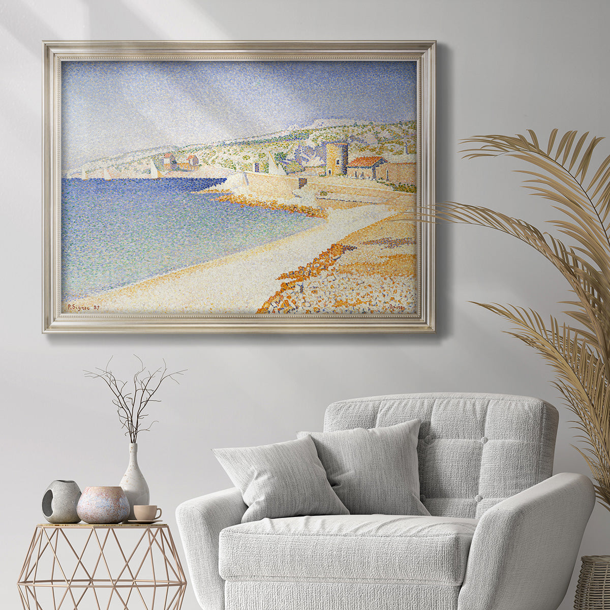 Impressionist Mediterranean jetty seascape by Paul Signac in an ornate champagne frame displayed in a bright interior setting.