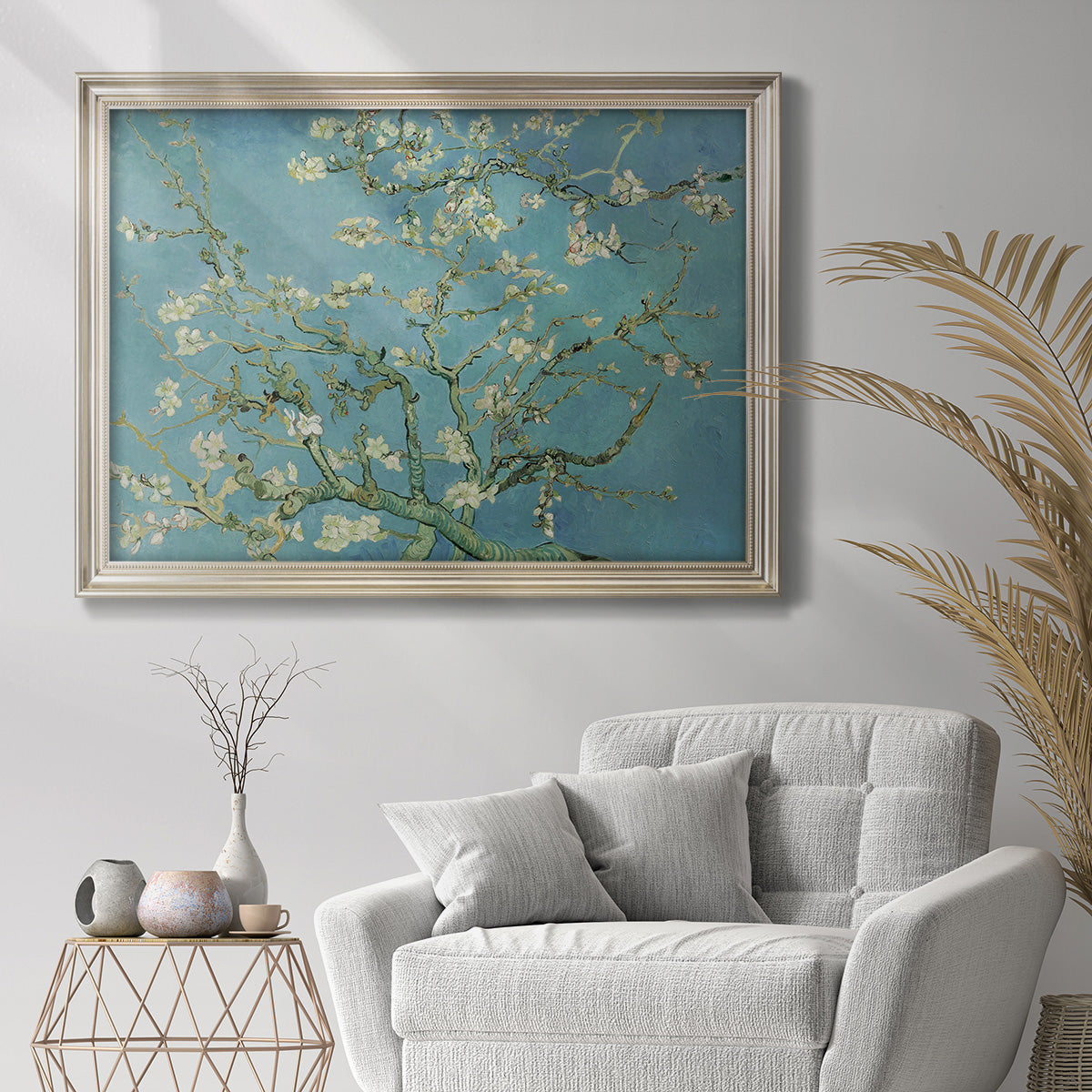 Impressionist flowering almond branch painting by Vincent van Gogh in an ornate champagne frame displayed in a bright interior setting.