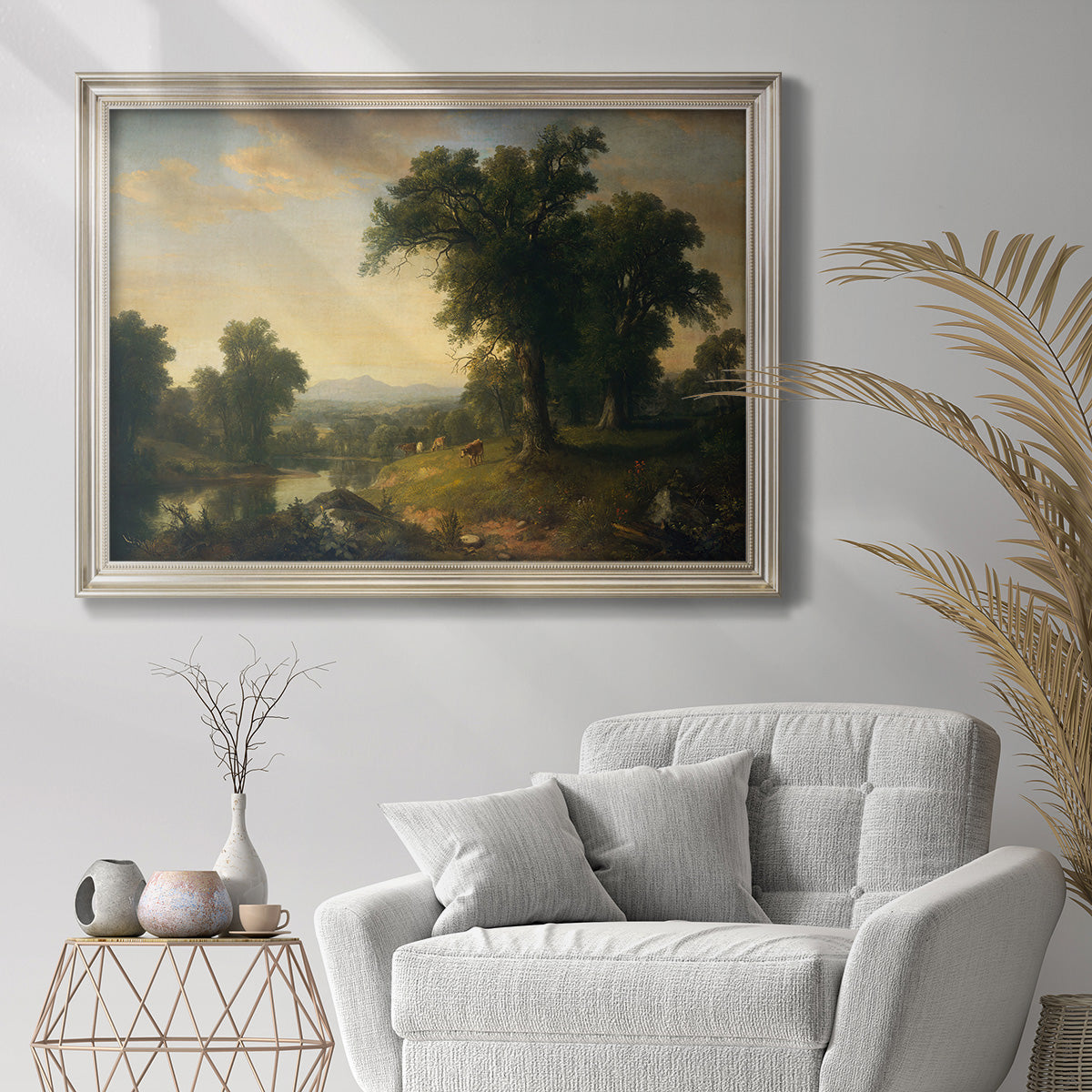 Traditional pastoral landscape painting by Asher Brown Durand in an ornate champagne frame displayed in a bright interior setting.