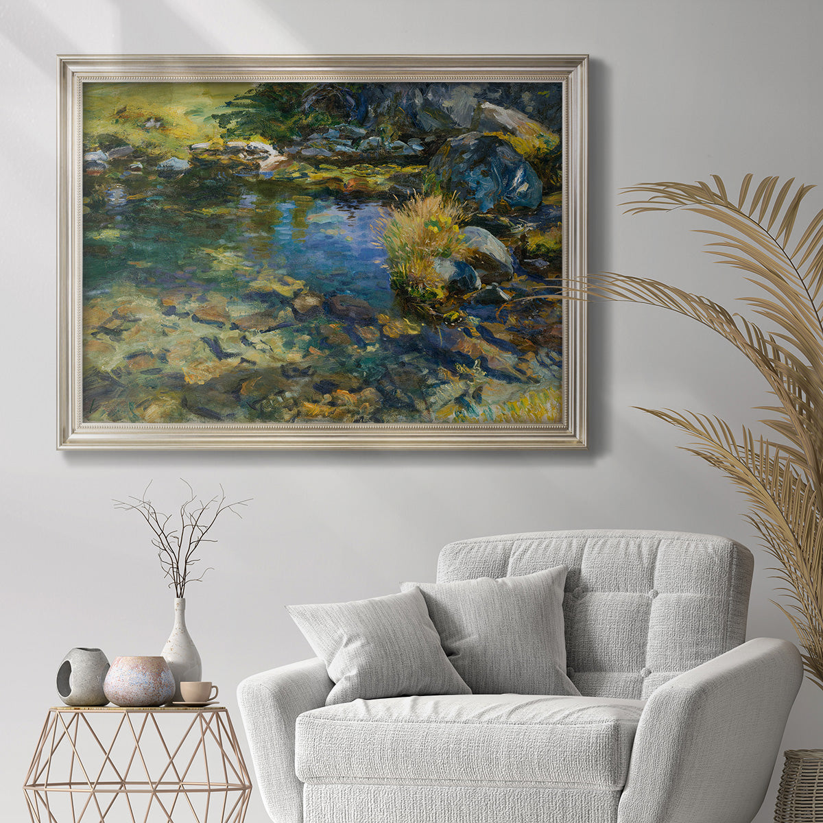 Impressionist alpine mountain water scene by John Singer Sargent in an ornate champagne frame displayed in a bright interior setting.