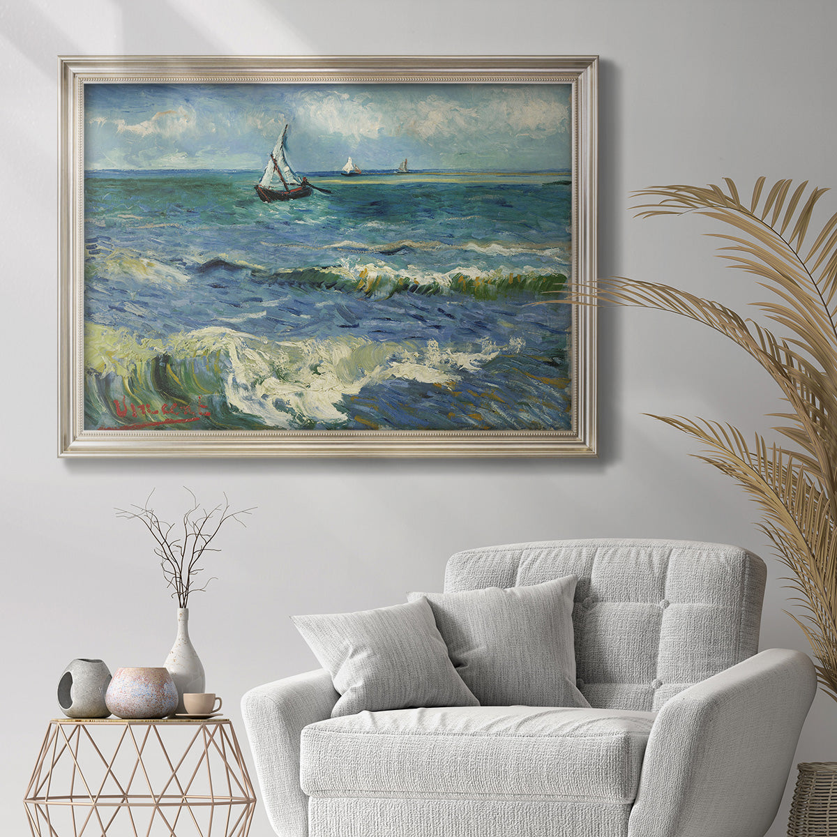 Impressionist coastal seascape by Vincent van Gogh in an ornate champagne frame displayed in a bright interior setting.