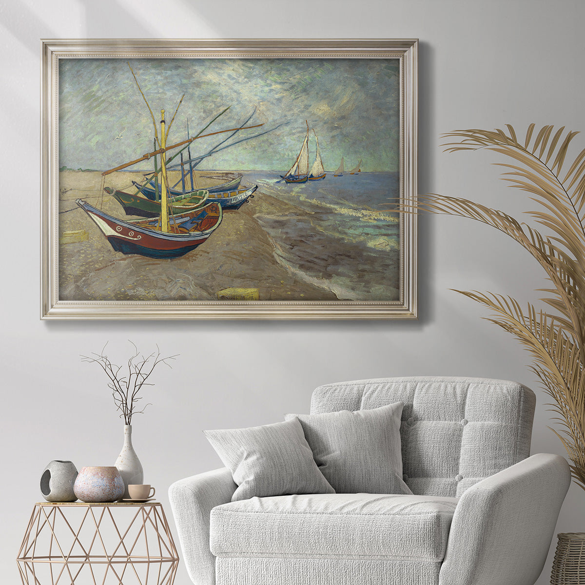 Impressionist coastal fishing boats scene by Vincent van Gogh in an ornate champagne frame displayed in a bright interior setting.