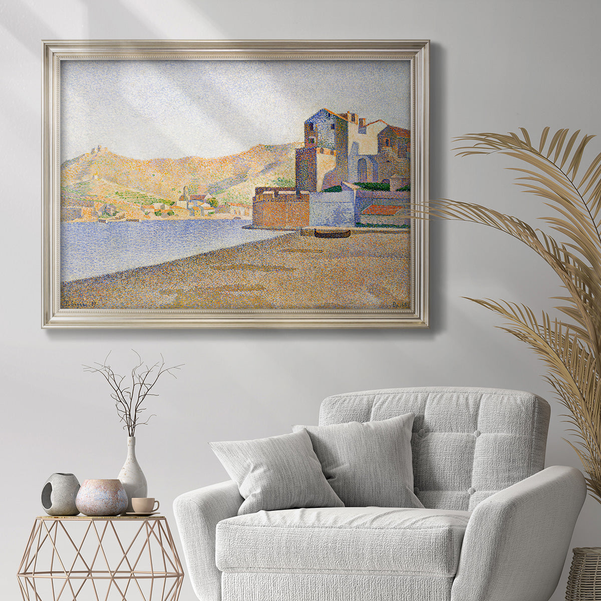 Impressionist beach town scene at Collioure by Paul Signac in an ornate champagne frame displayed in a bright interior setting.