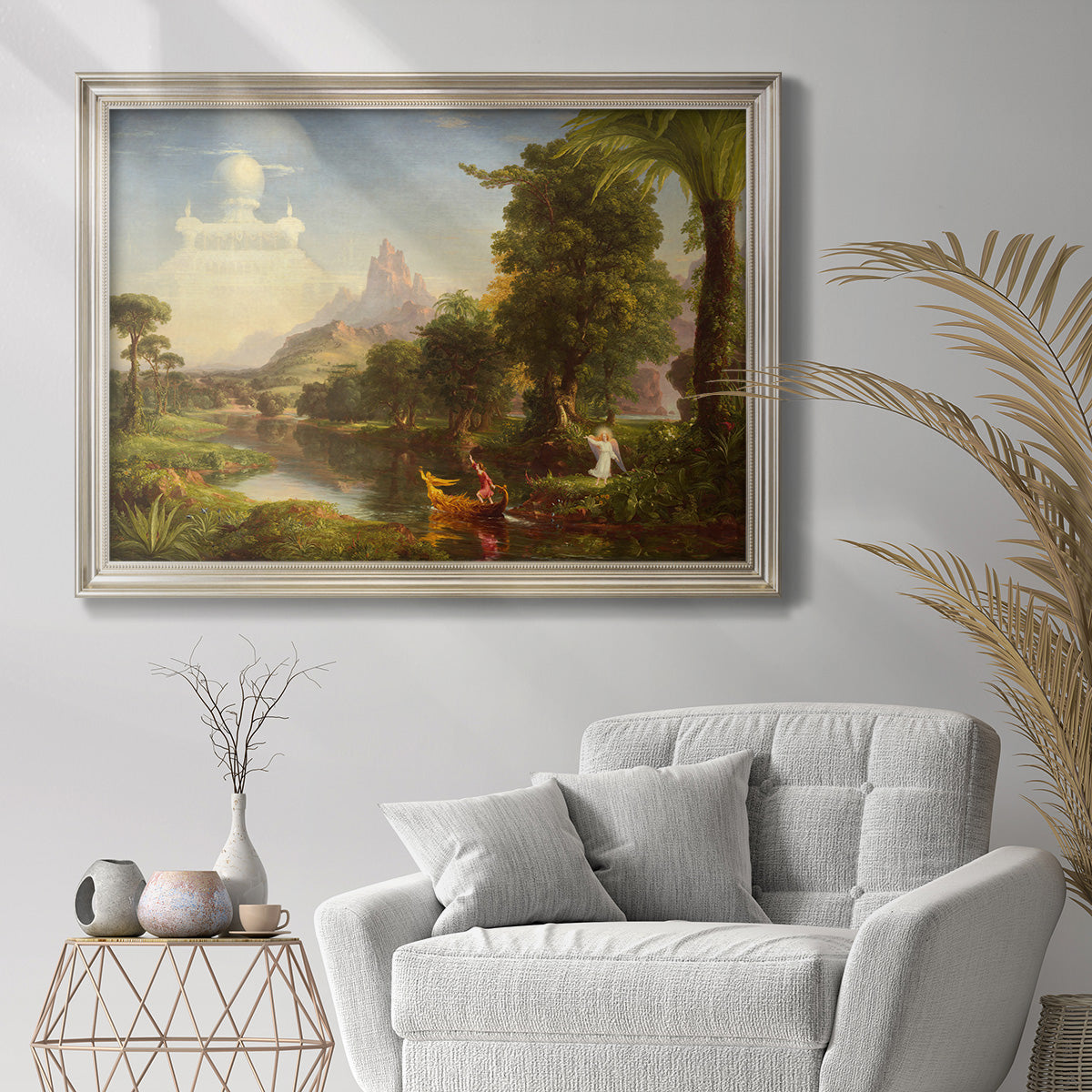 Symbolic landscape representing youth by Thomas Cole in an ornate champagne frame displayed in a bright interior setting.
