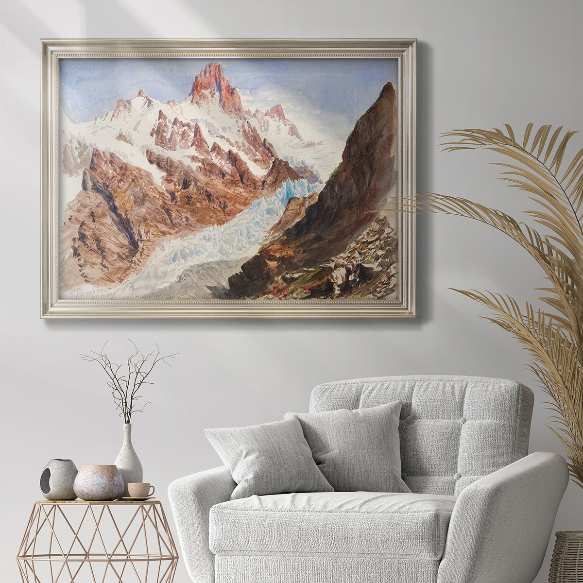 Impressionist glacier and mountain landscape by John Singer Sargent in an ornate champagne frame displayed in a bright interior setting.