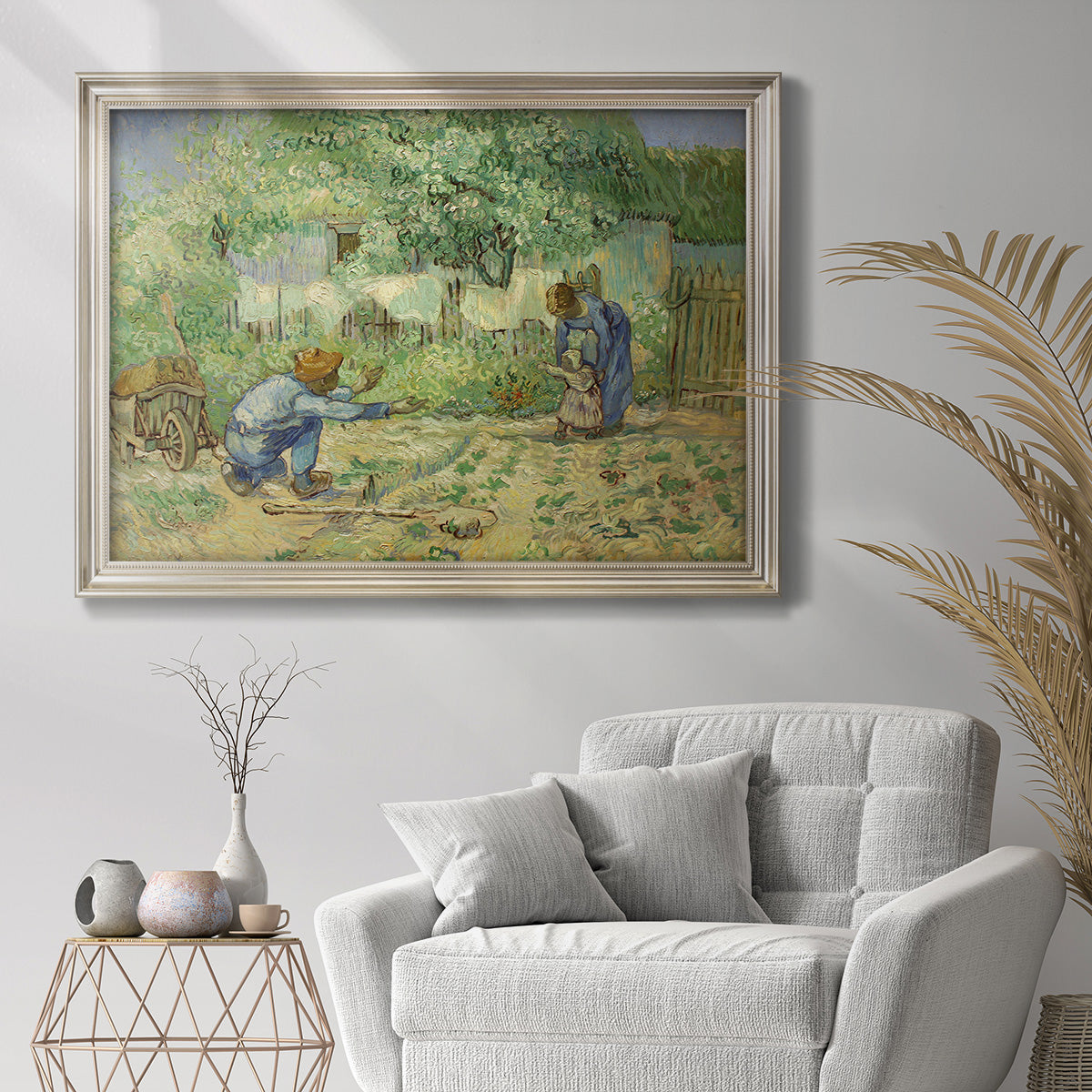 Impressionist family scene in a garden by Vincent van Gogh in an ornate champagne frame displayed in a bright interior setting.