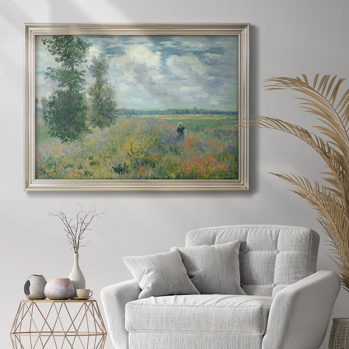 Impressionist poppy field landscape at Argenteuil by Claude Monet in an ornate champagne frame displayed in a bright interior setting.
