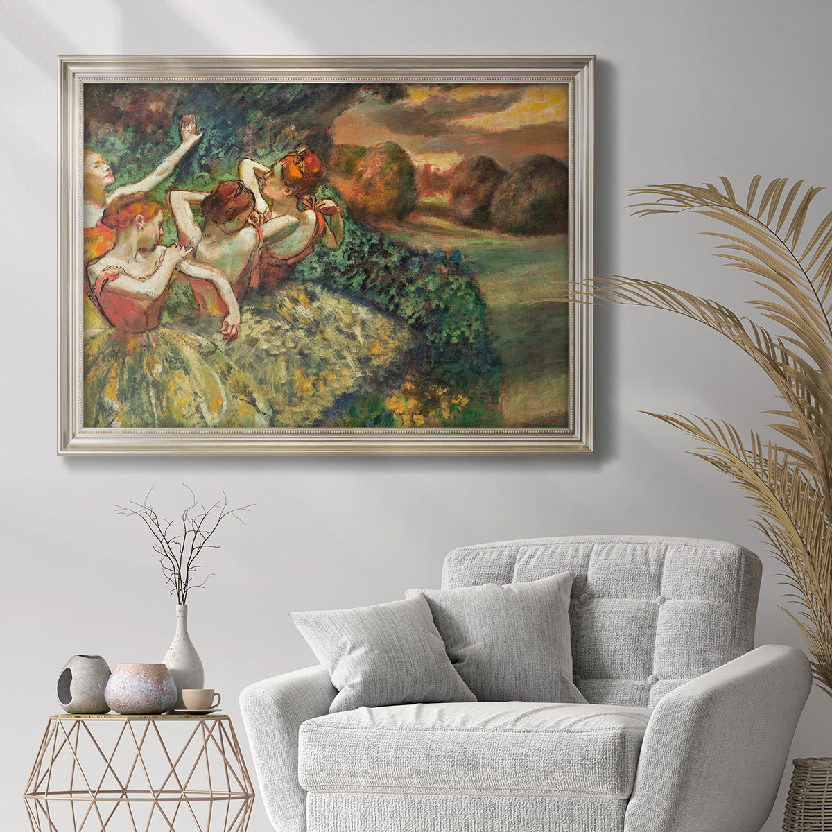 Impressionist ballet dancer composition by Edgar Degas in an ornate champagne frame displayed in a bright interior setting.
