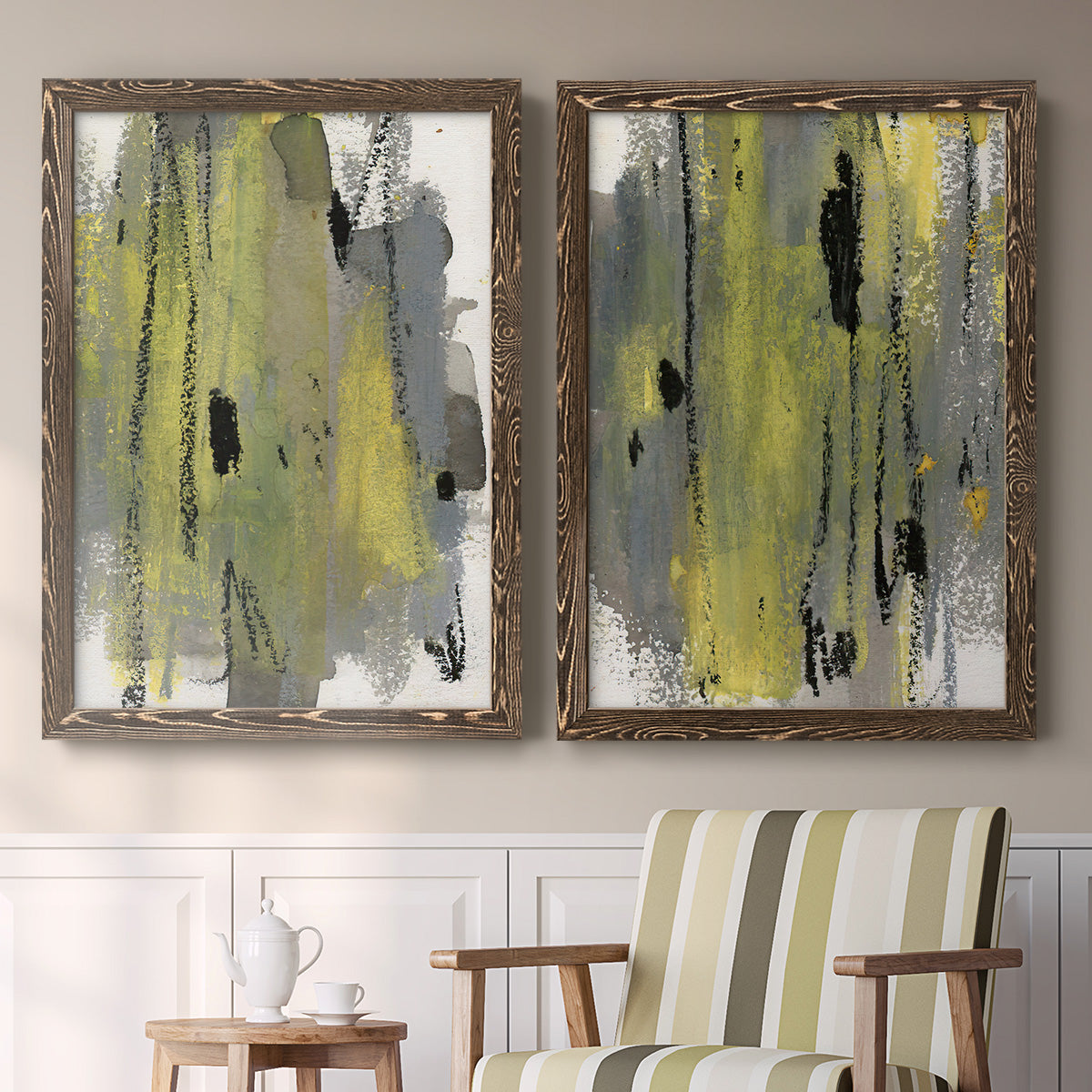 Set of two walnut barnwood framed canvas prints depicting two urban mixed-media abstracts featuring vertical abstract brush bands in changing muted palettes above a sideboard in a cozy sitting room.