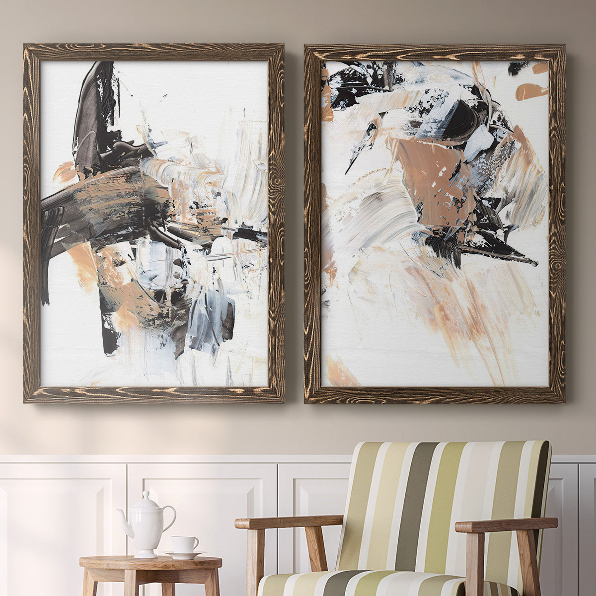 Set of two walnut barnwood framed canvas prints depicting two bold mixed-media abstracts featuring energetic black white tan and gray painted gestures above a sideboard in a cozy sitting room.