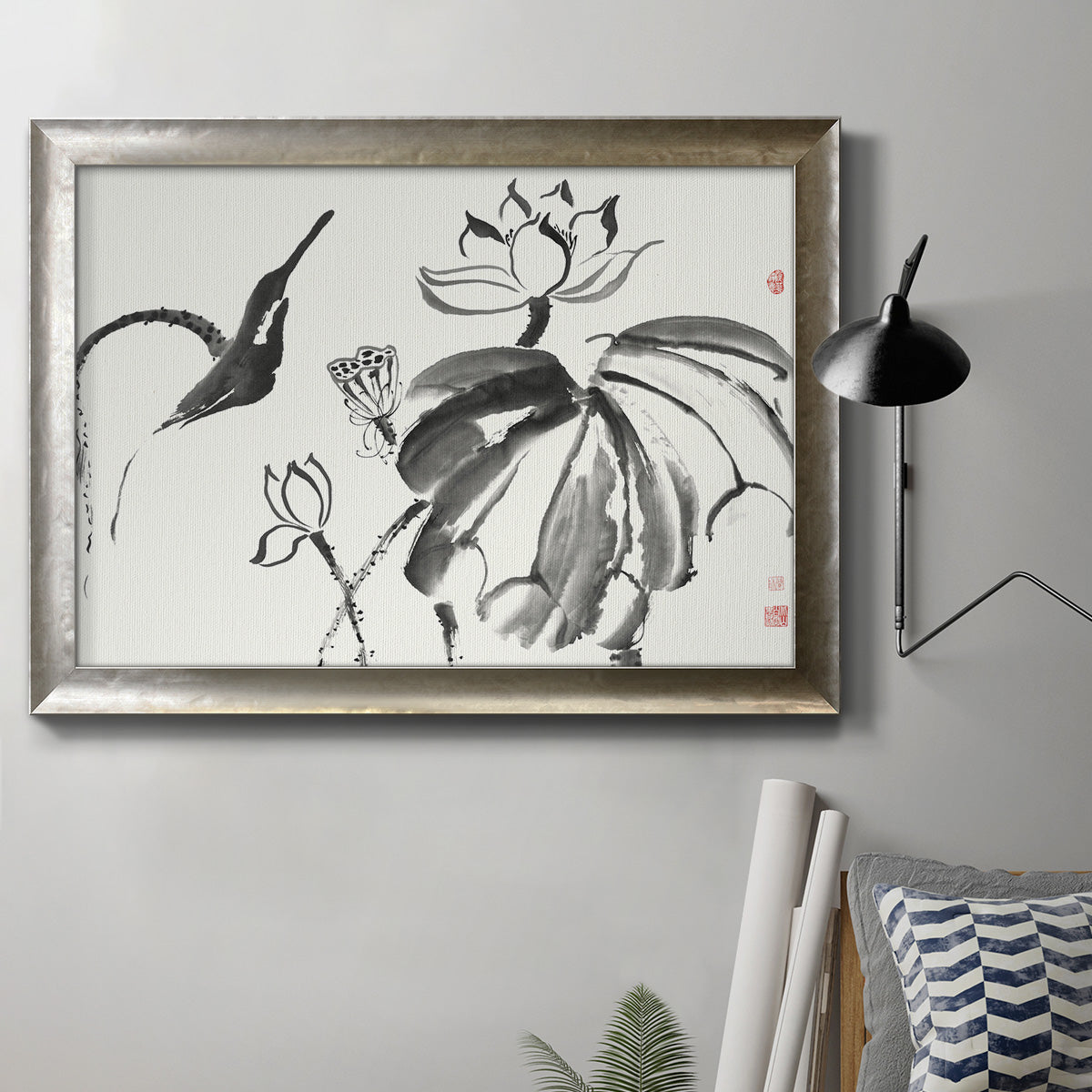 Asian-inspired lotus flower illustration in an ornate mottled silver frame displayed in a neutral interior setting.