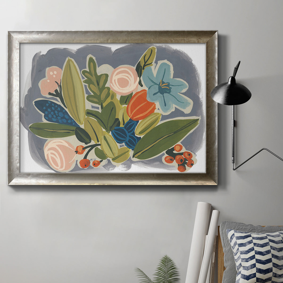 Colorful eclectic botanical artwork in an ornate mottled silver frame displayed in a neutral interior setting.