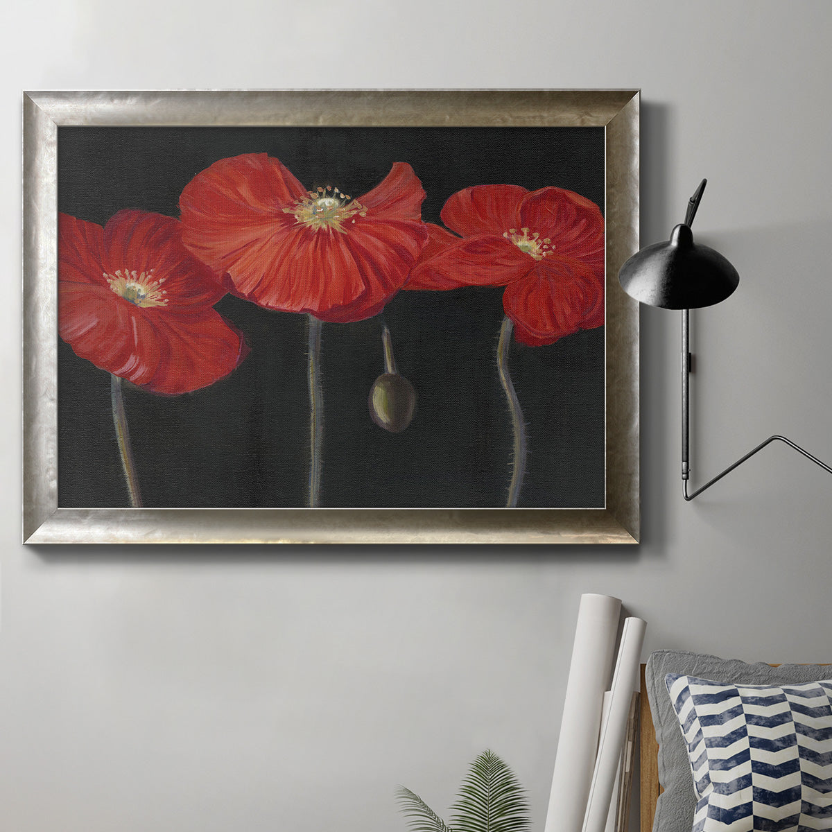 Modern red poppy floral artwork in an ornate mottled silver frame displayed in a neutral interior setting.