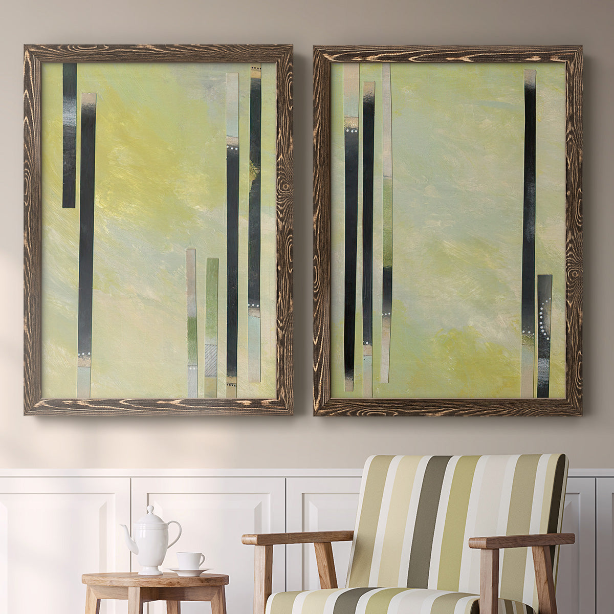 Set of two walnut barnwood framed canvas prints depicting two minimalist architectural abstracts featuring vertical black gray and olive bars above a sideboard in a cozy sitting room.
