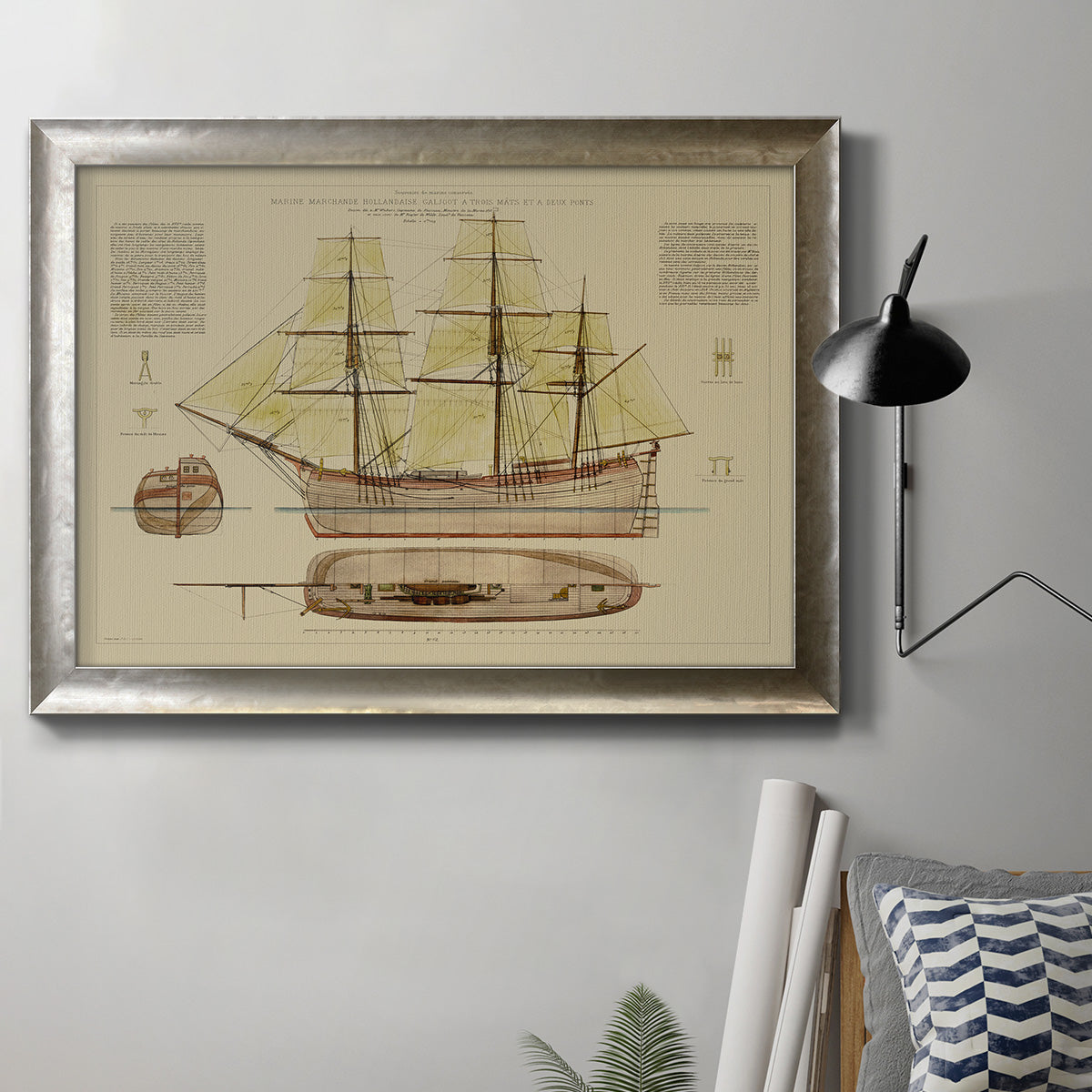 Antique sailing ship plan diagram in an ornate mottled silver frame displayed in a neutral interior setting.
