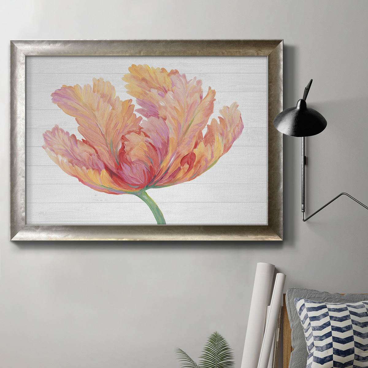 Modern minimalist pink floral artwork in an ornate mottled silver frame displayed in a neutral interior setting.