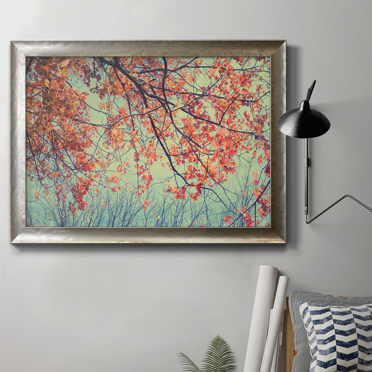 Eclectic fall floral landscape artwork in an ornate mottled silver frame displayed in a neutral interior setting.