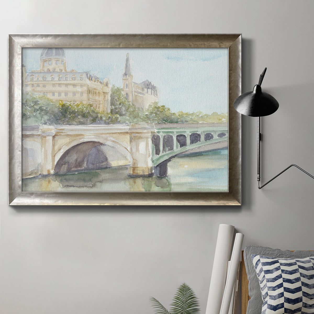 Classical watercolor painting of a French bridge in an ornate mottled silver frame displayed in a neutral interior setting.