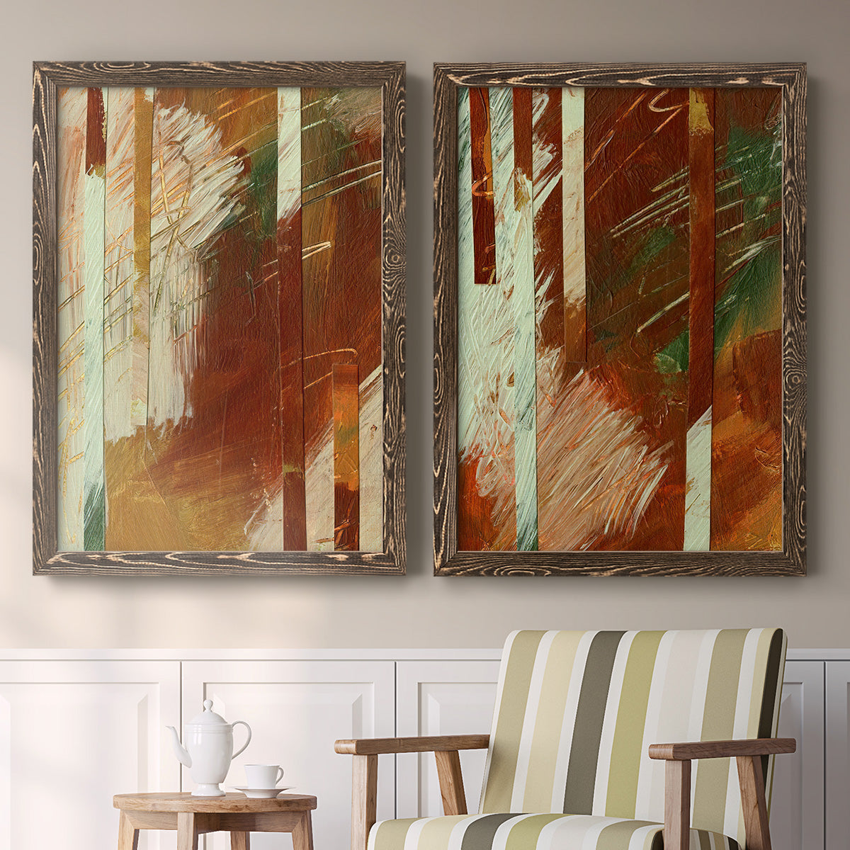Set of two walnut barnwood framed canvas prints depicting two earthy modern abstracts featuring rust orange black cream and green brush bands above a sideboard in a cozy sitting room.