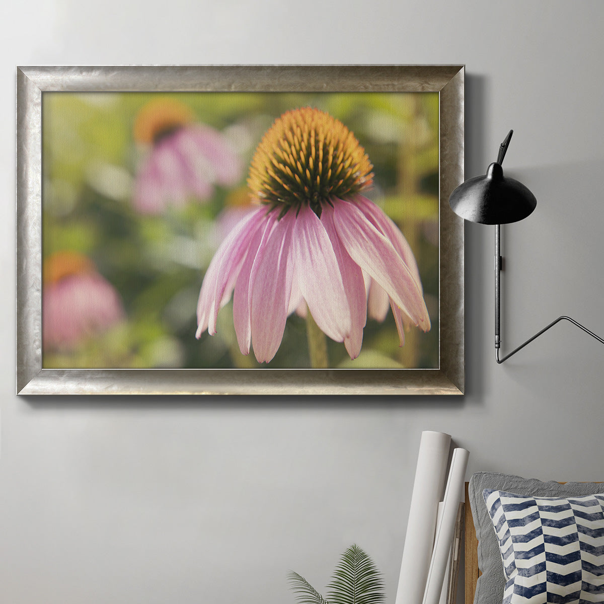 Echinacea flower botanical photography in an ornate mottled silver frame displayed in a neutral interior setting.
