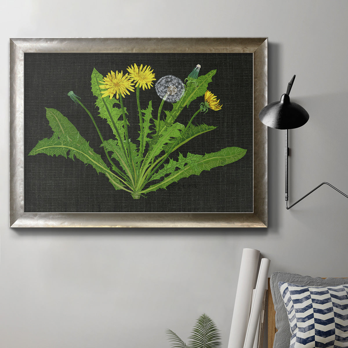 Classic botanical dandelion illustration in an ornate mottled silver frame displayed in a neutral interior setting.