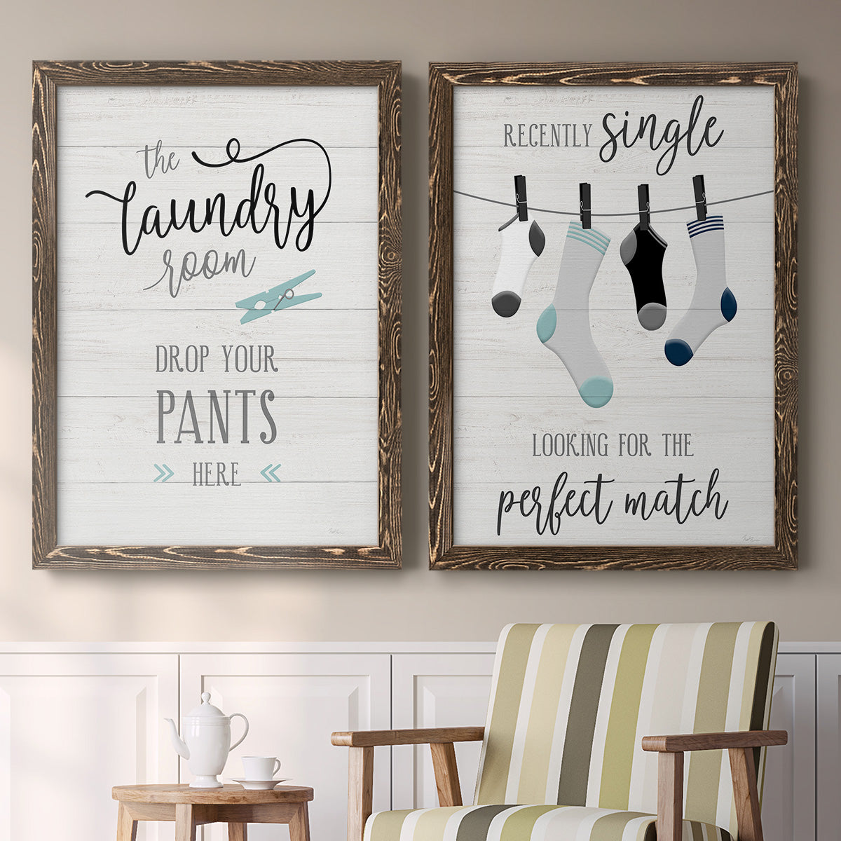 Set of two walnut barnwood framed canvas prints depicting two rustic typographic wall art featuring humorous laundry-room sayings and clothing icons above a sideboard in a cozy sitting room.
