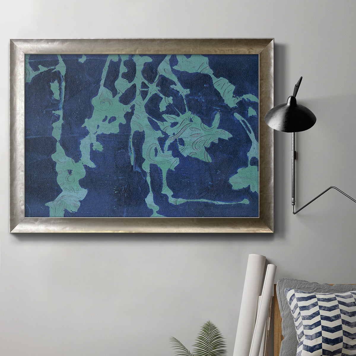 Industrial abstract botanical in an ornate mottled silver frame displayed in a neutral interior setting.
