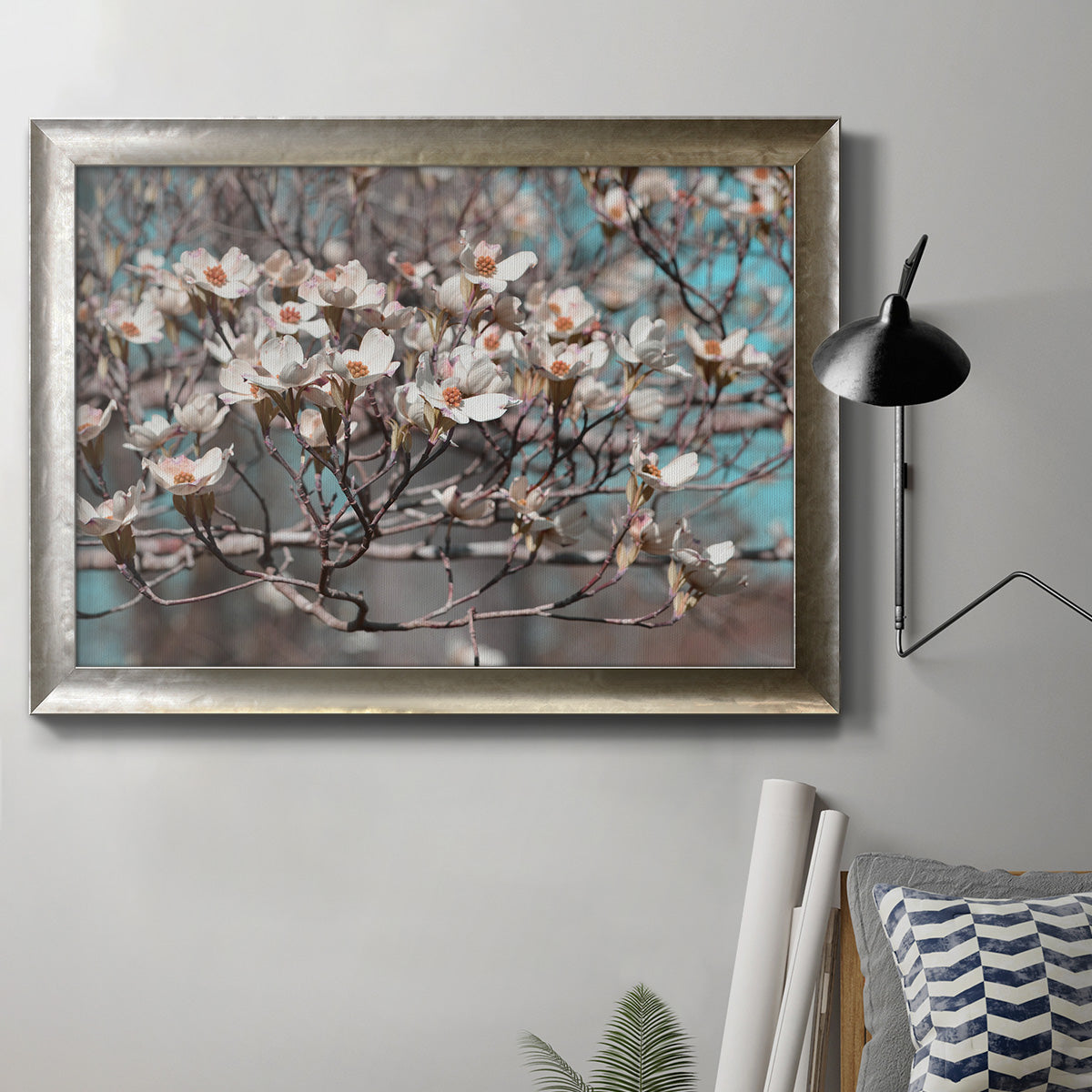 Modern spring dogwood flower photograph in an ornate mottled silver frame displayed in a neutral interior setting.