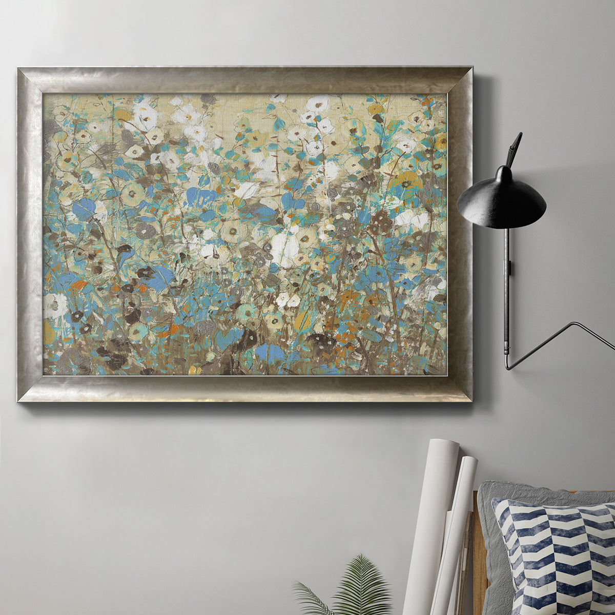 Impressionist flowering vine watercolor artwork in an ornate mottled silver frame displayed in a neutral interior setting.