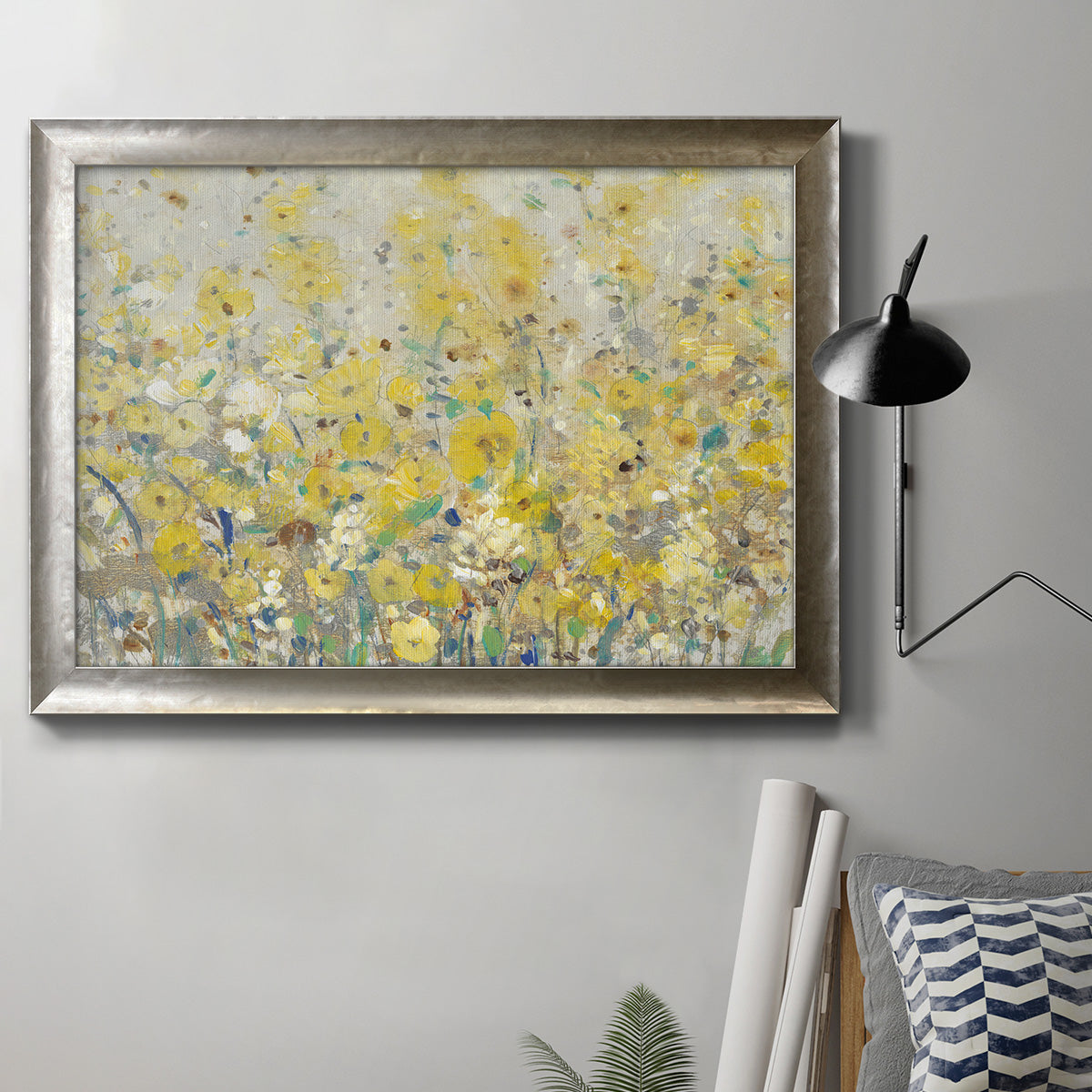 Impressionist floral garden painting in an ornate mottled silver frame displayed in a neutral interior setting.