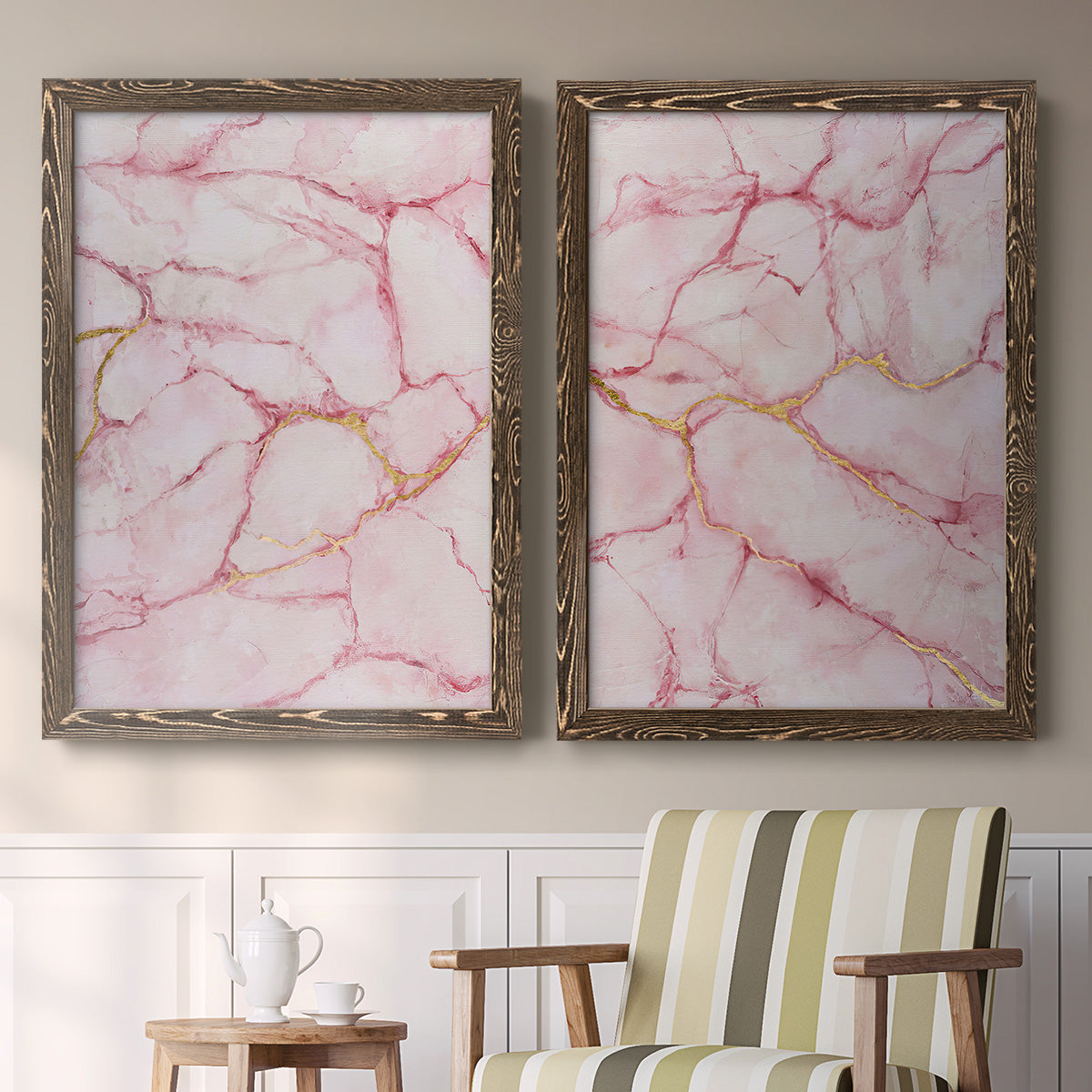 Set of two walnut barnwood framed canvas prints depicting two soft stone-inspired abstracts featuring pink marble veining with fine gold lines above a sideboard in a cozy sitting room.