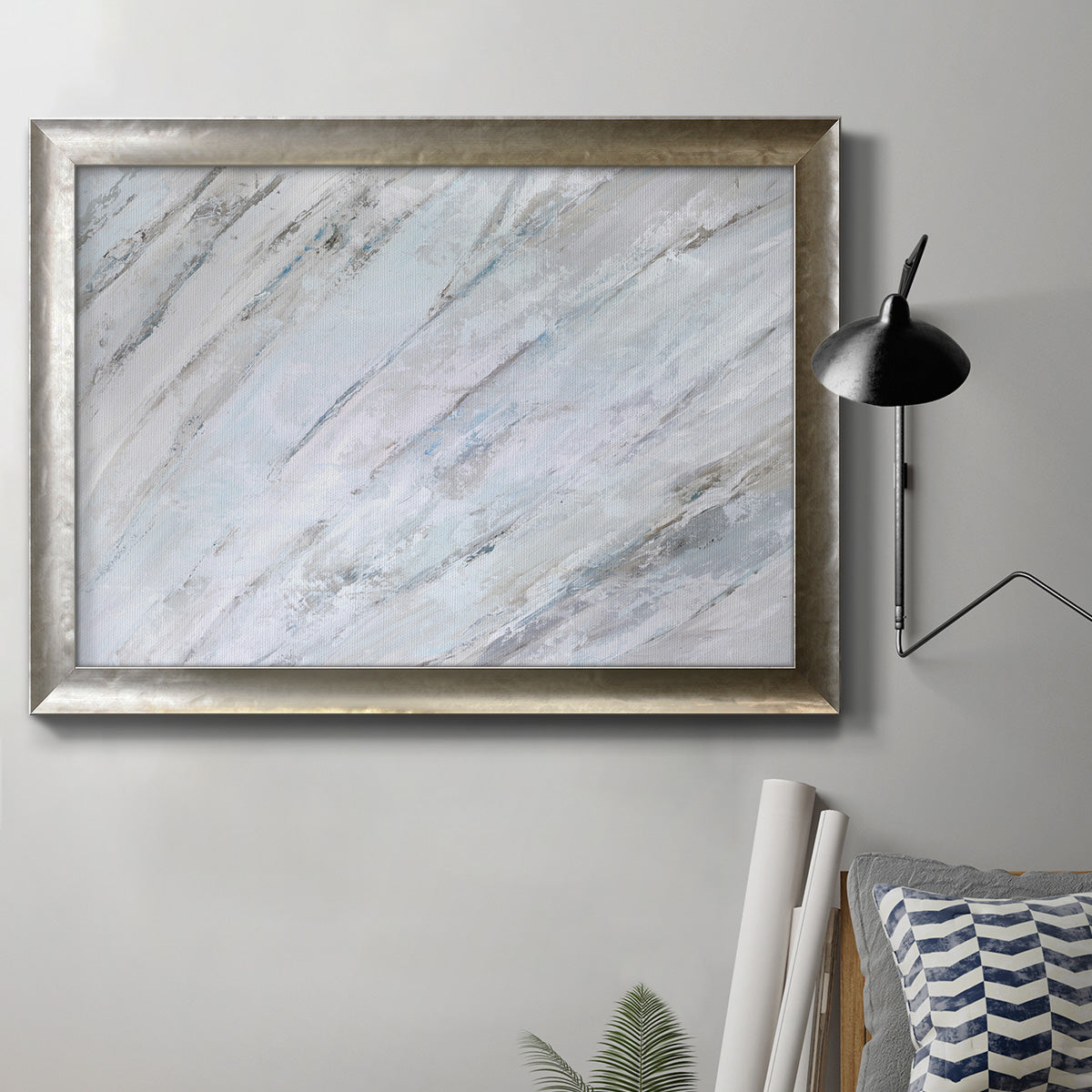 Contemporary minimalist abstract frond design in an ornate mottled silver frame displayed in a neutral interior setting.