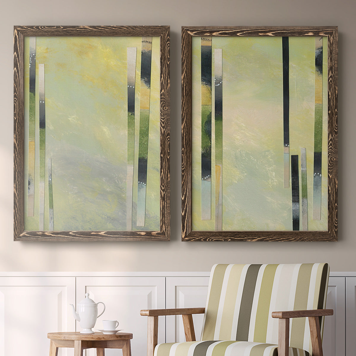 Set of two walnut barnwood framed canvas prints depicting two minimalist architectural abstracts featuring vertical black gray and olive bars above a sideboard in a cozy sitting room.
