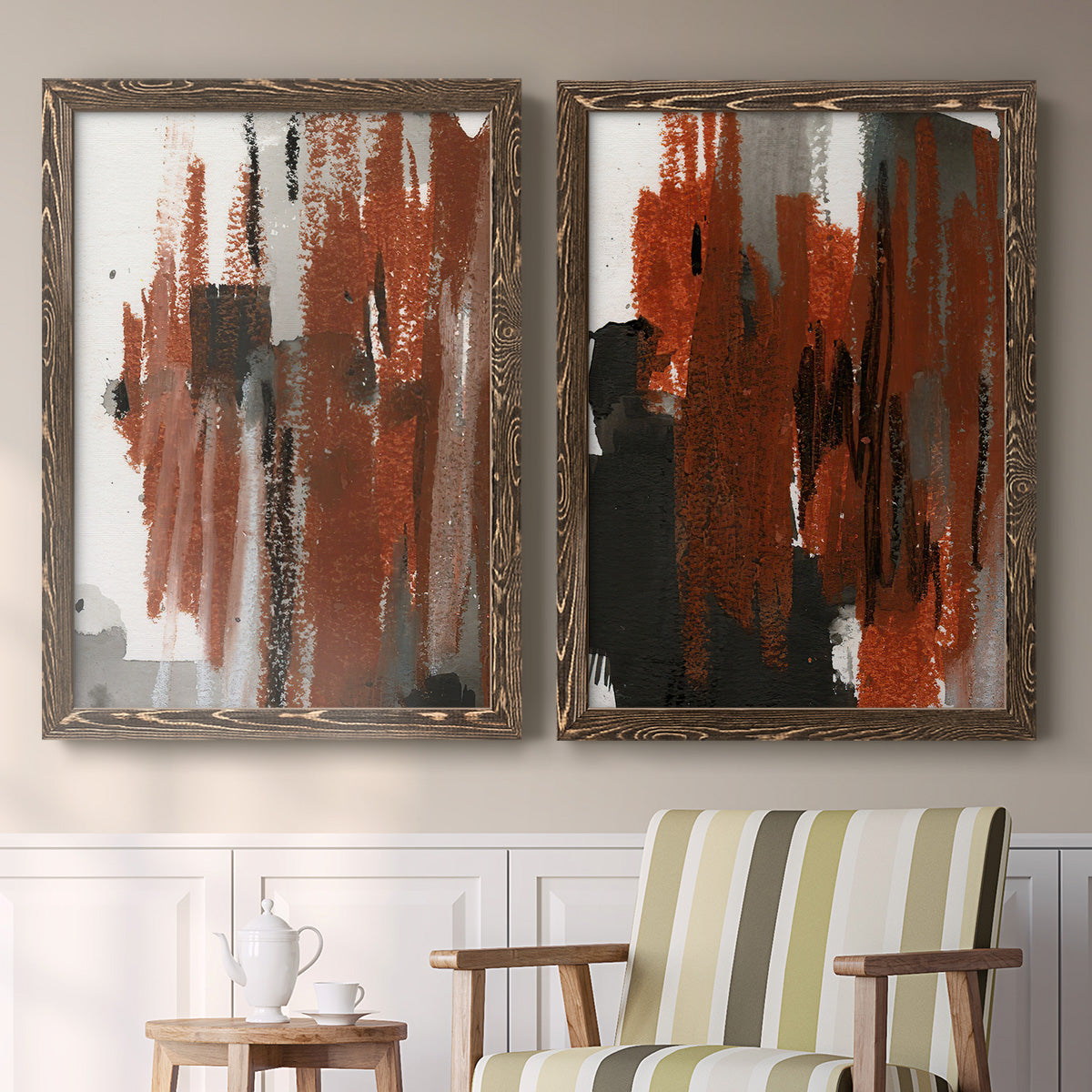 Set of two walnut barnwood framed canvas prints depicting two urban mixed-media abstracts featuring vertical abstract brush bands in changing muted palettes above a sideboard in a cozy sitting room.