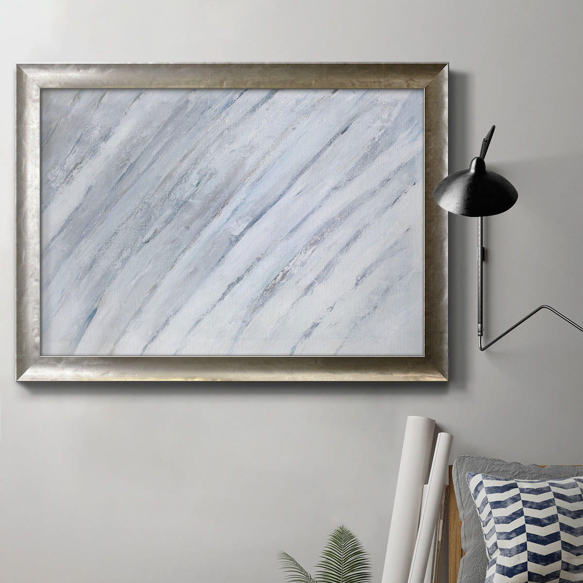 Zen-inspired minimalist abstract frond artwork in an ornate mottled silver frame displayed in a neutral interior setting.