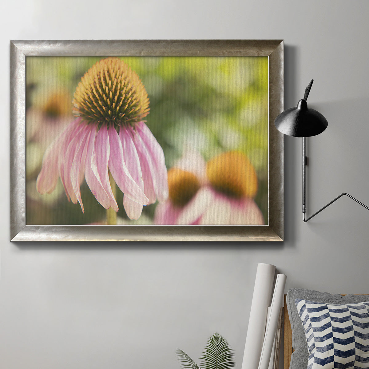 Close-up echinacea bloom photography in an ornate mottled silver frame displayed in a neutral interior setting.