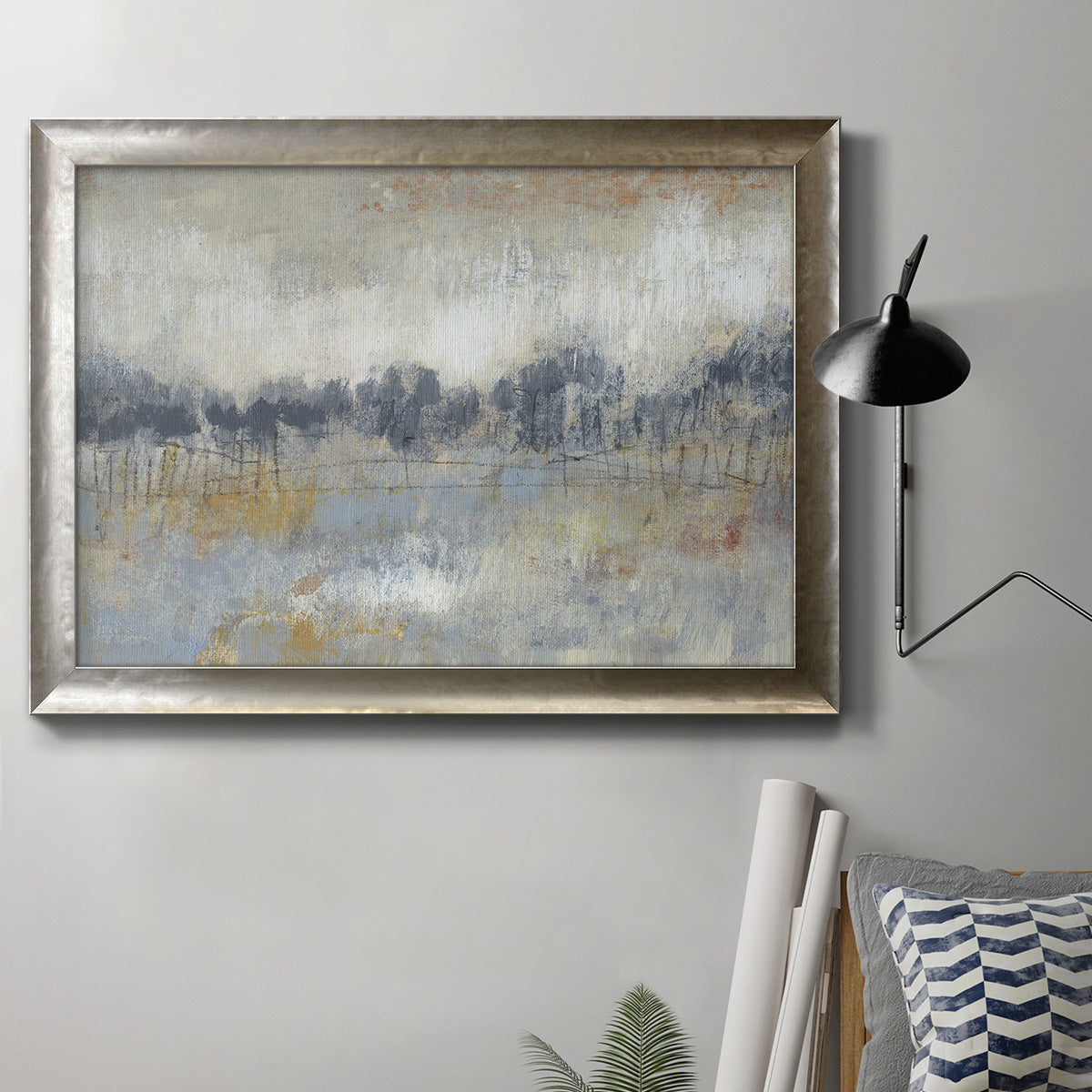 Minimalist abstract landscape artwork in an ornate mottled silver frame displayed in a neutral interior setting.