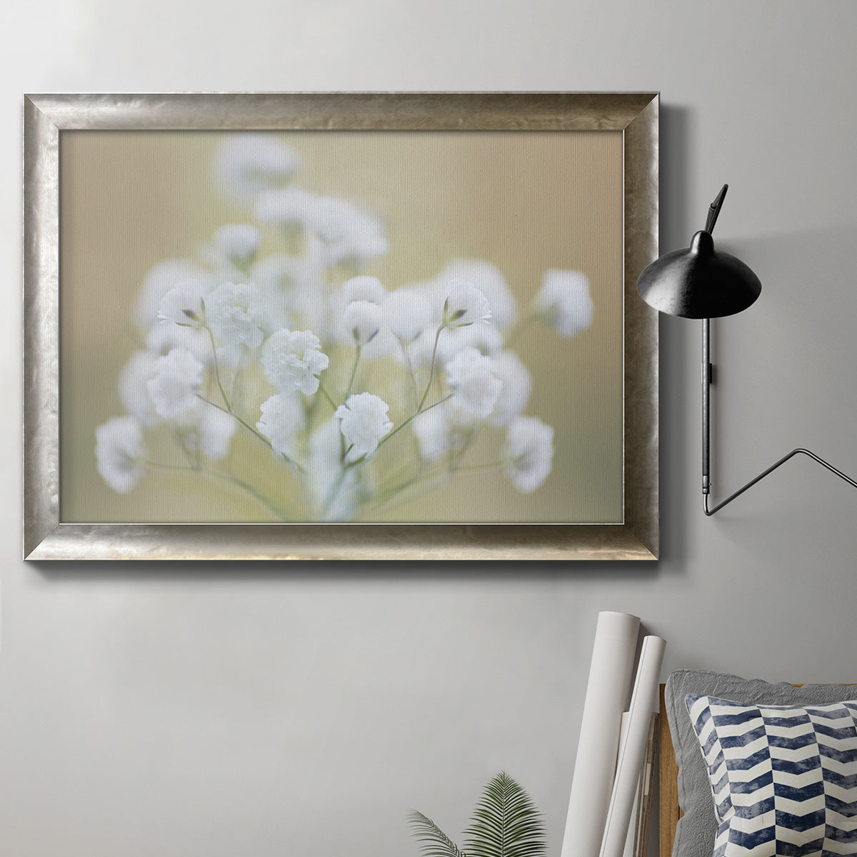 Botanical baby’s breath flower photography in an ornate mottled silver frame displayed in a neutral interior setting.