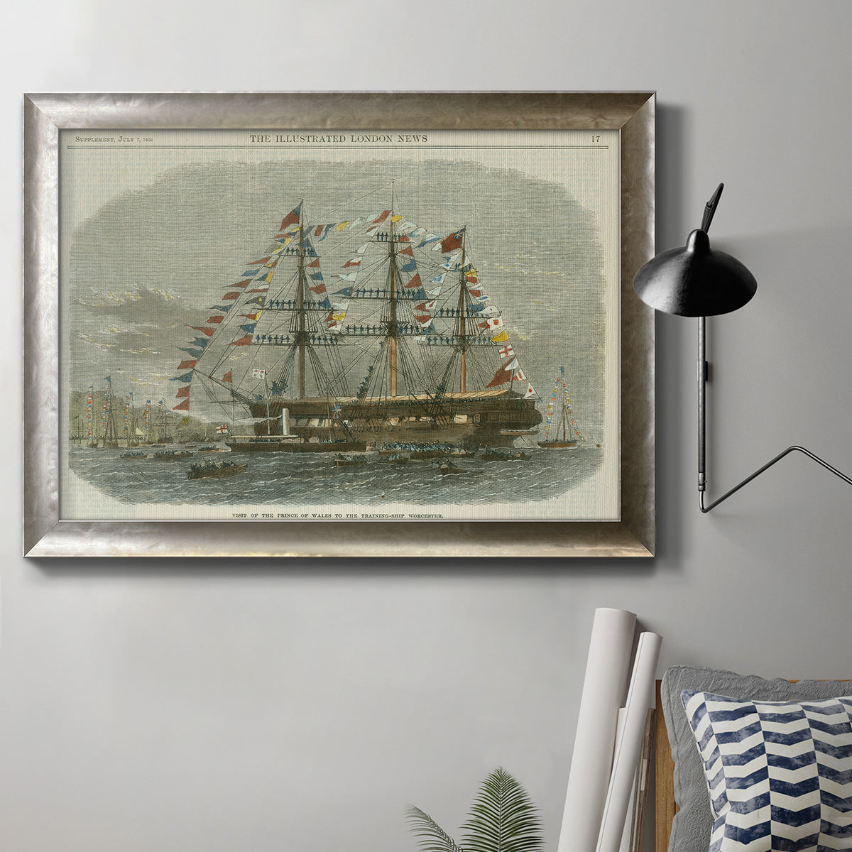Antique clipper ship nautical illustration in an ornate mottled silver frame displayed in a neutral interior setting.