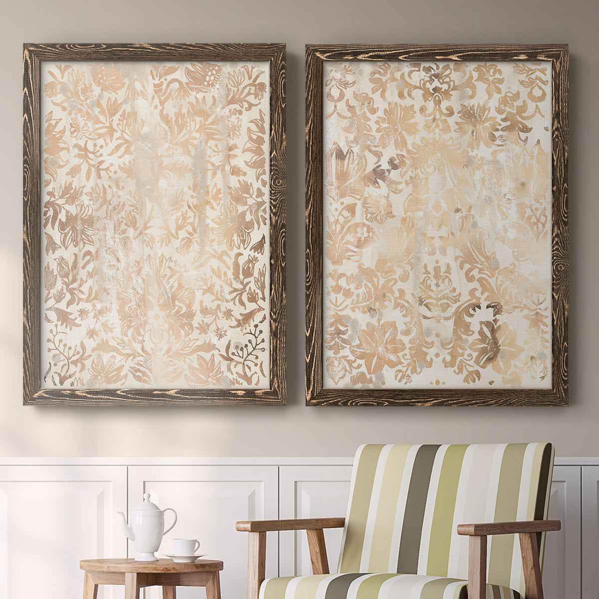 Set of two walnut barnwood framed canvas prints depicting two vintage decorative prints featuring ornate cream floral damask patterns above a sideboard in a cozy sitting room.