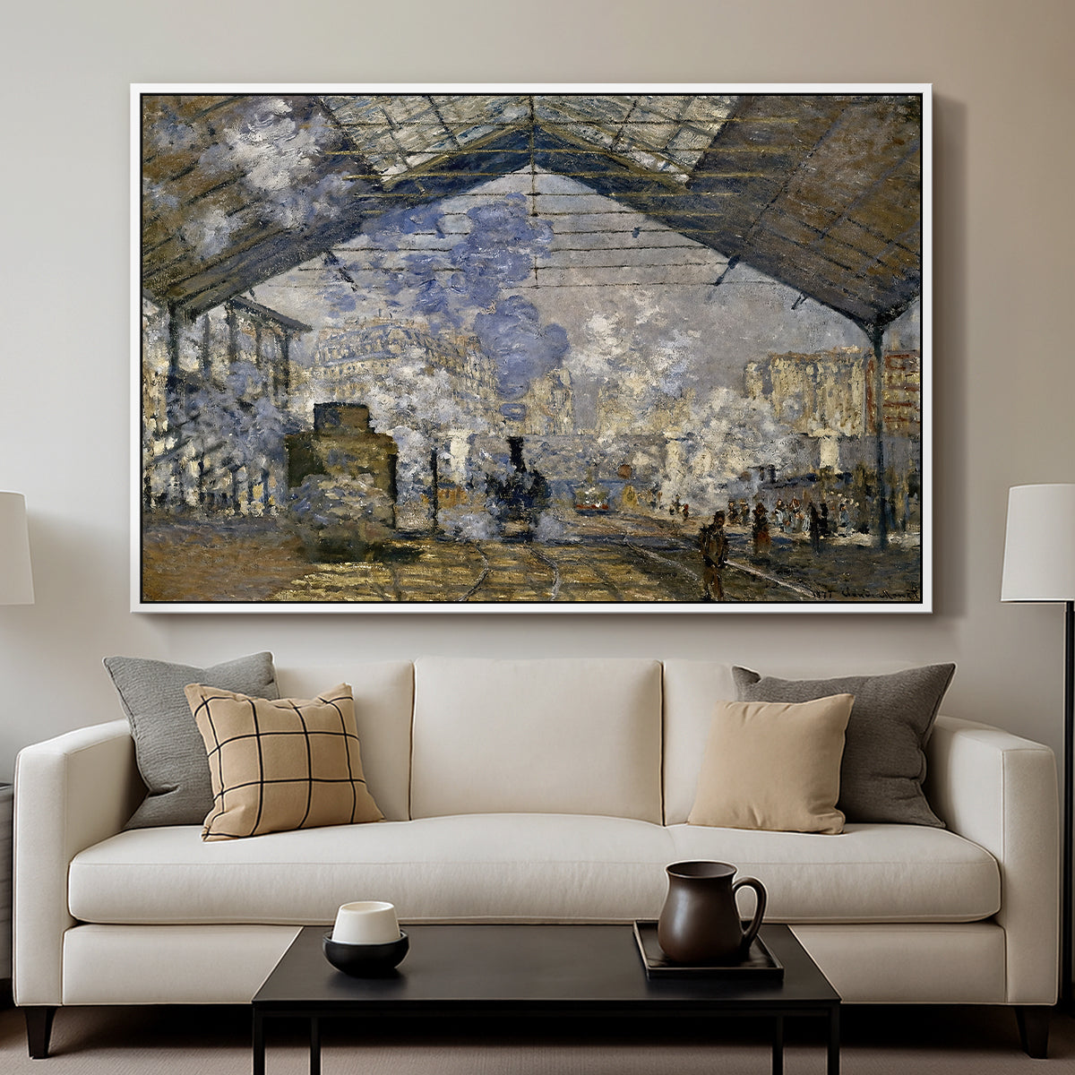The Gare Saint-Lazare, 1877 by Claude Monet displayed in a white floater framed canvas above a sofa in a clean living room.