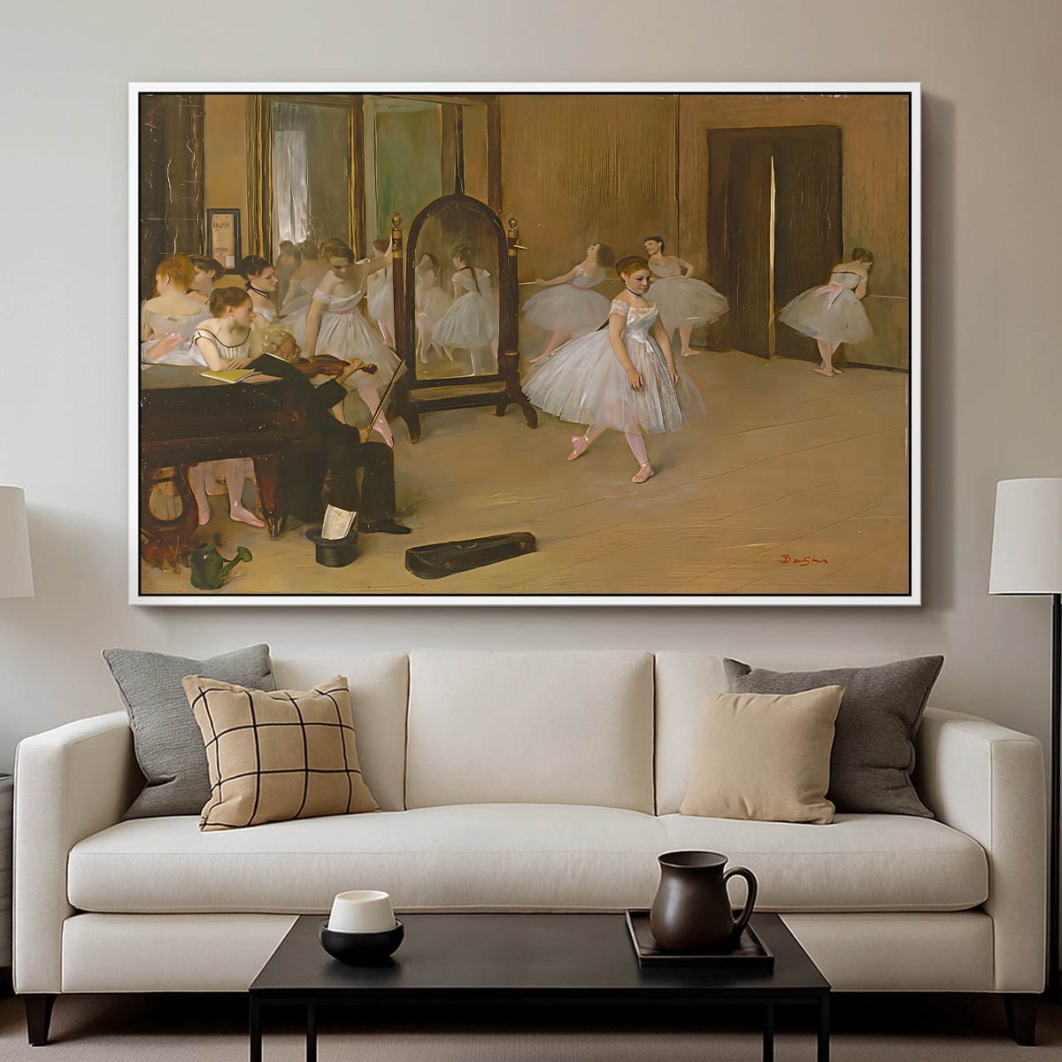 The Dancing Class, c. 1870 by Edgar Degas displayed in a white floater framed canvas above a sofa in a clean living room.