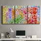 Three-panel canvas wall art featuring peaceful tropical inspired landscape, displayed above a desk in a home office.