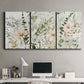 Three-panel canvas wall art featuring vintage floral botanical sketchbook, displayed above a desk in a home office.