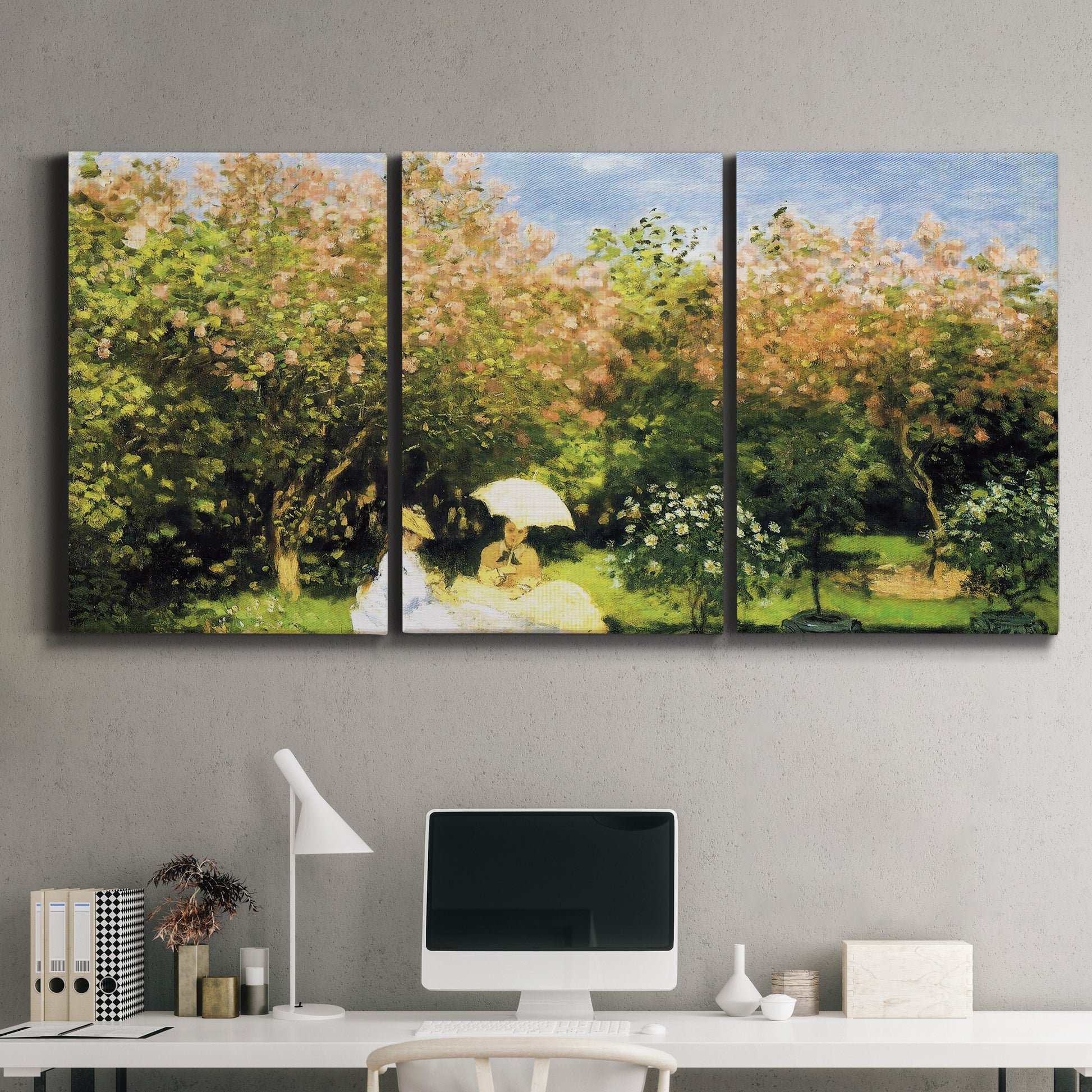 Three-panel canvas wall art featuring lush garden landscape with trees, displayed above a desk in a home office.