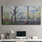 Three-panel canvas wall art featuring fresh spring countryside landscape, displayed above a desk in a home office.