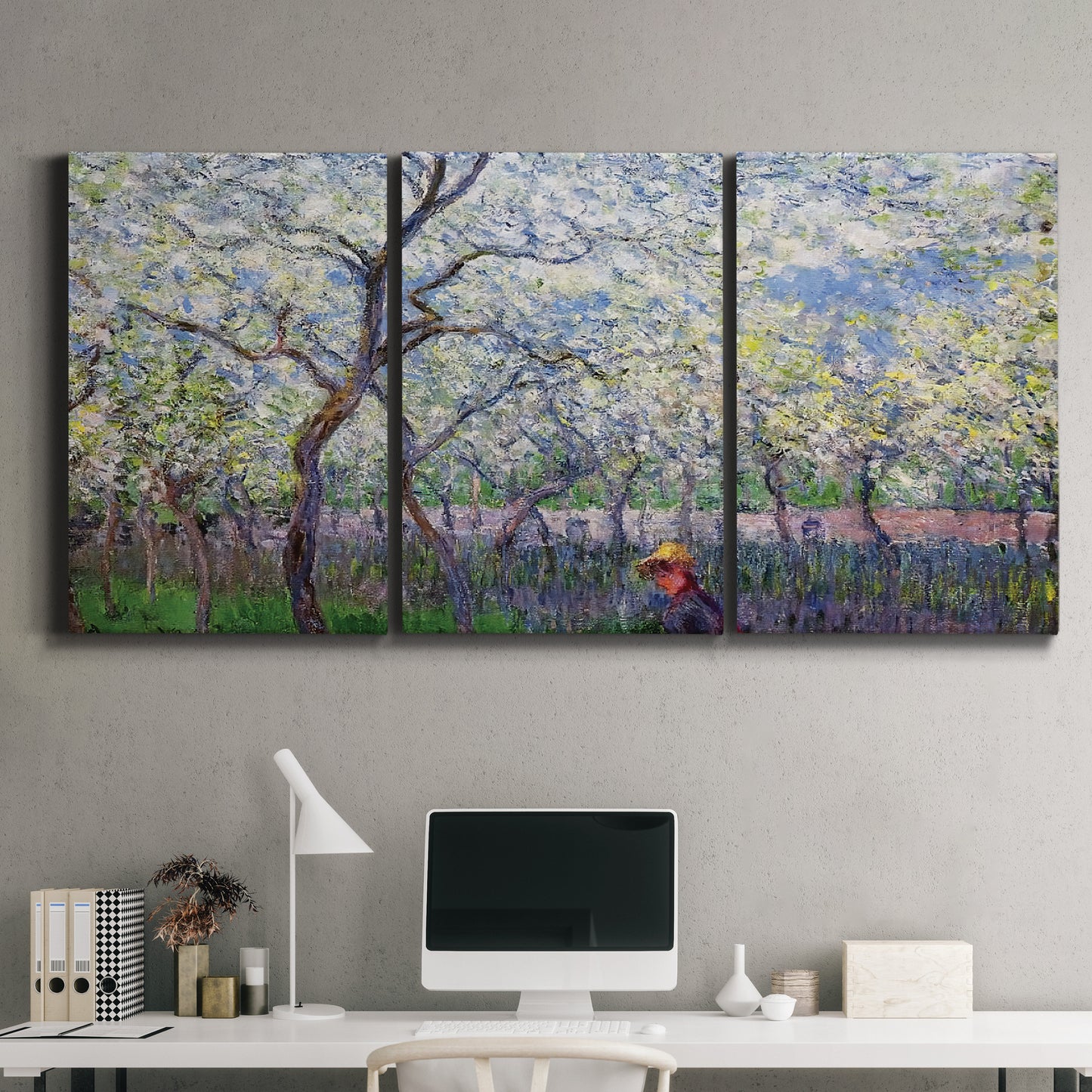 Three-panel canvas wall art featuring fresh spring countryside landscape, displayed above a desk in a home office.