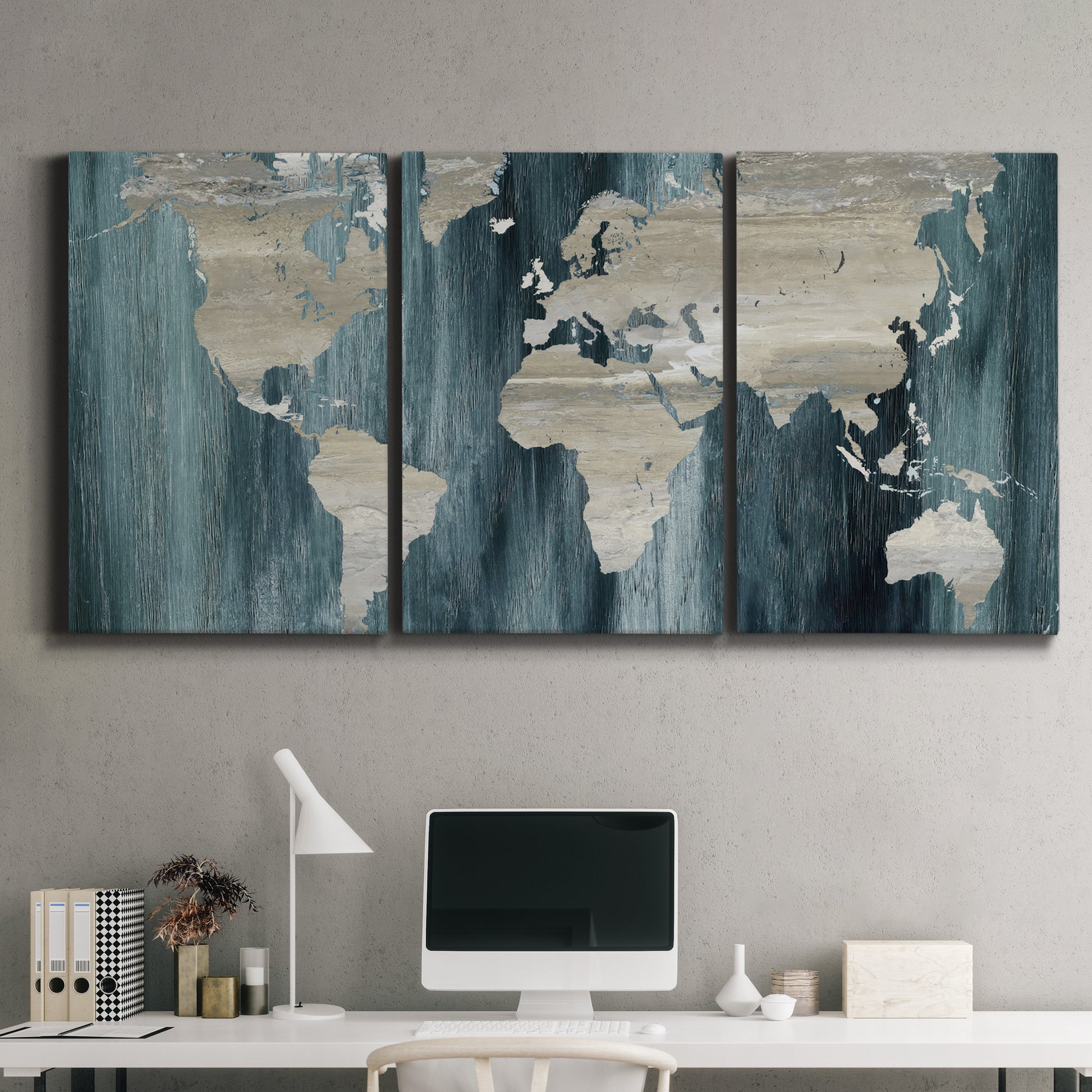 Three-panel canvas wall art featuring golden coastal sunset with cliffs, displayed above a desk in a home office.