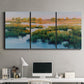 Three-panel canvas wall art featuring pastoral marshland landscape, displayed above a desk in a home office.